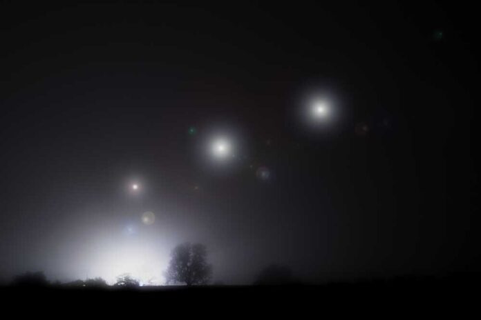 Glowing,Alien,Ufo,Lights,Floating,In,The,Sky.,On,A