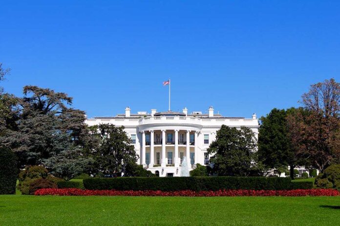 1051409453 featured image The White House with flags and trees.