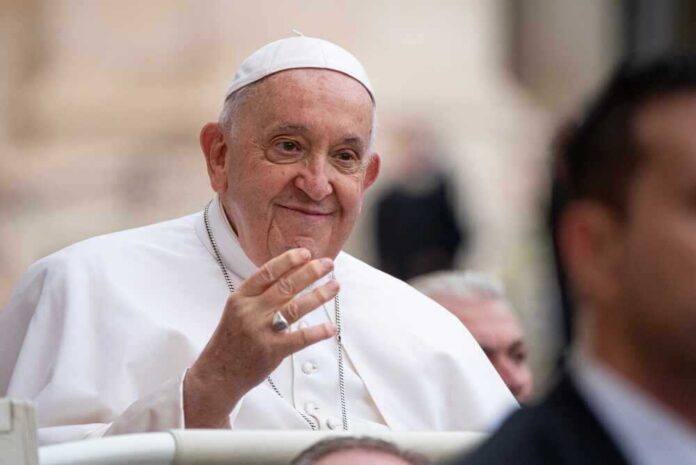 Pope Francis smiling and greeting people.