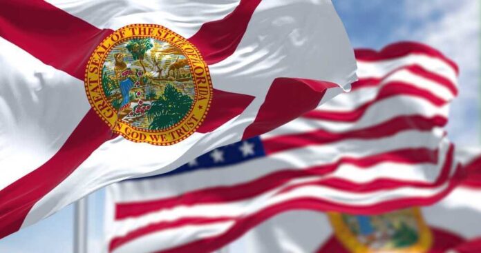 Florida state flags waving in the wind.