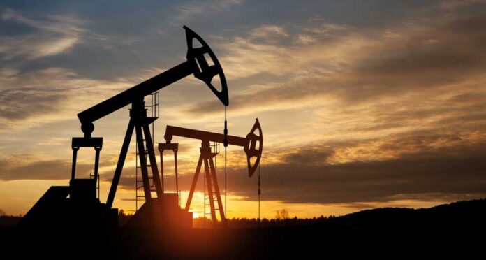 shutterstock_2283367131.jpg featured image Oil pump jacks silhouetted against sunrise sky