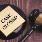 Gavel and case closed note on table