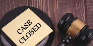 Gavel and case closed note on table