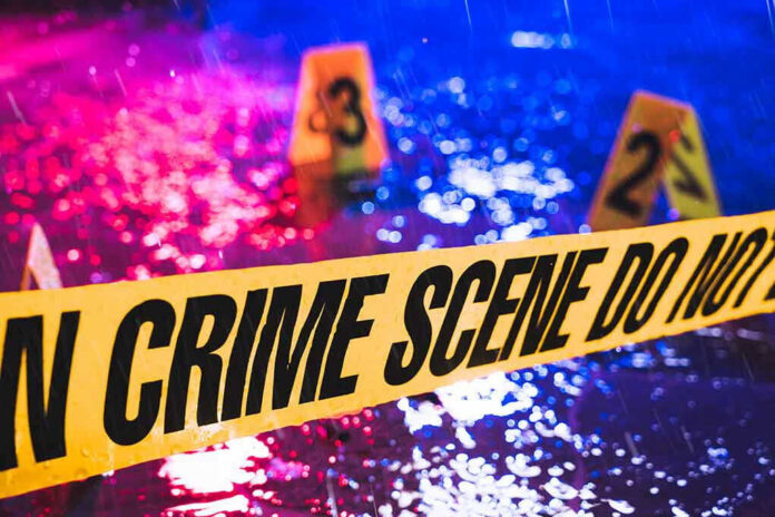 789623020 Crime scene tape with blurred evidence markers