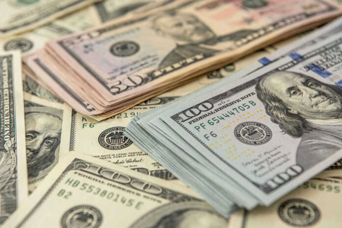 shutterstock_1936085086.jpg Stacks of US dollars