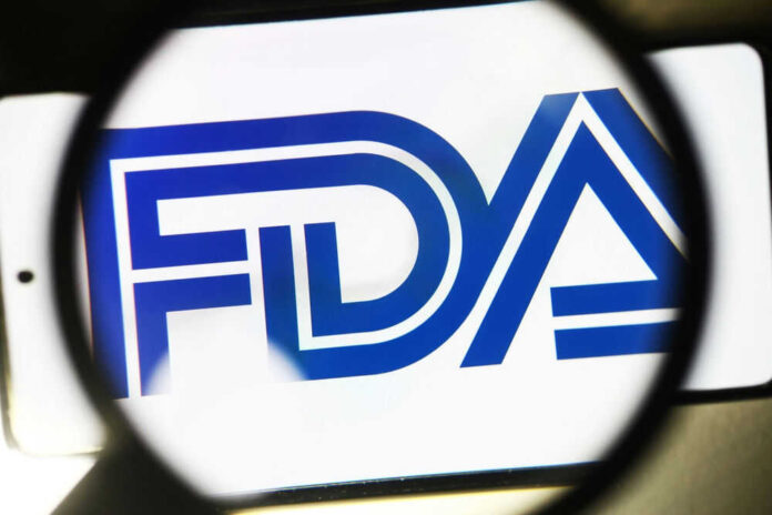 shutterstock_2274913075.jpg FDA Logo Under Magnifying Glass