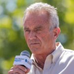 Robert F. Kennedy Jr. speaking into a microphone.