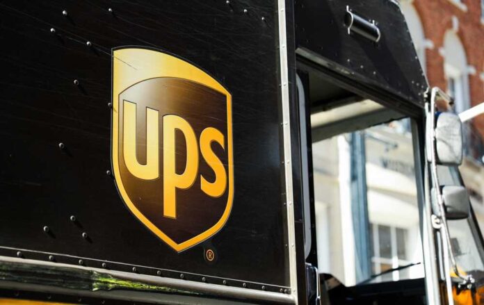 shutterstock_2386261953.jpg featured image Black delivery truck with UPS logo visible
