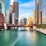River with city skyline and bridge background