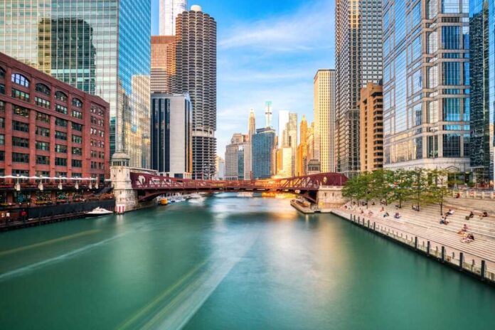 shutterstock_2465300267.jpg featured image River with city skyline and bridge background