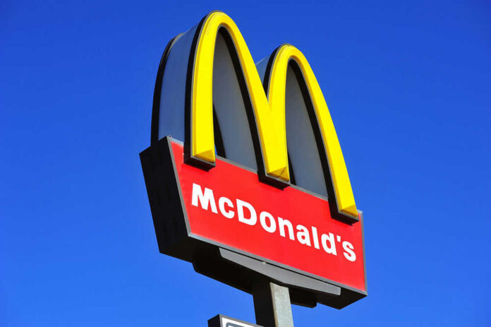 McDonalds logo on a pole clear sky