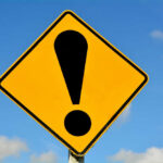 Yellow caution sign with exclamation mark symbol