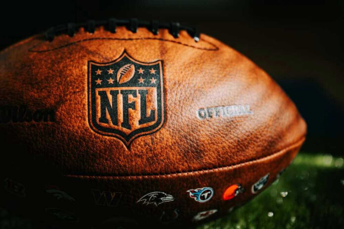 Close-up of an NFL football on grass