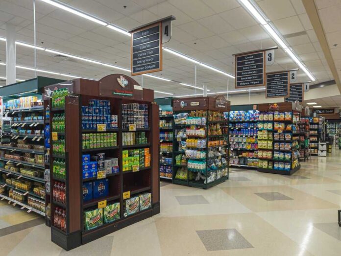 Interior view of a grocery store aisle with shelves of food and beverages