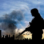 Soldier with rifle silhouetted against smoky city skyline.