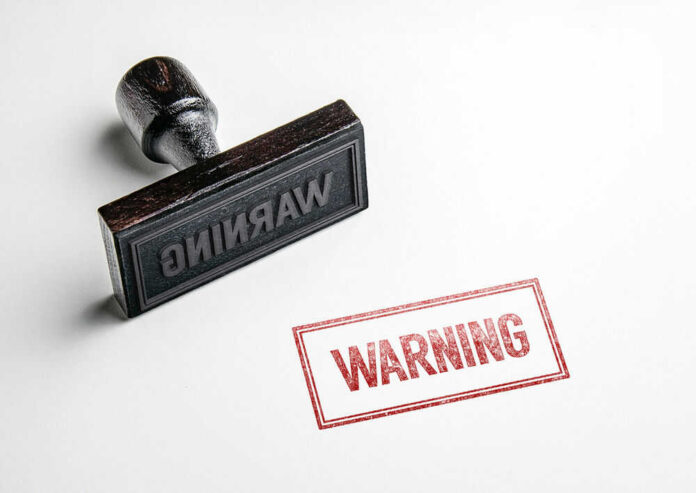 shutterstock_457118080.jpg Rubber stamp with warning text imprint
