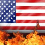 American flag partially engulfed in flames