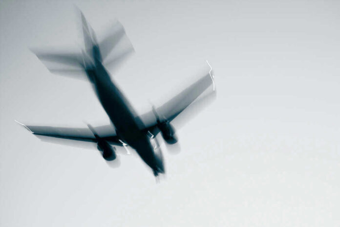 Airplane in flight with motion blur