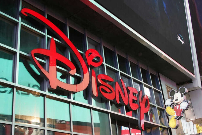Disney sign on building with Mickey Mouse figure