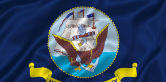 United States Navy flag with eagle and ship.