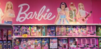 Display of various Barbie dolls and accessories in a retail store