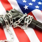 Hawaii’s 96% Gun Ban Under Supreme Fire A handgun wrapped in chains on an American flag