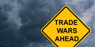 Yellow warning sign reads Trade Wars Ahead