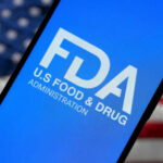 FDA Sounds Alarm — Massive Recall FDA logo on smartphone American flag background