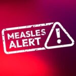 Measles alert warning sign with exclamation mark