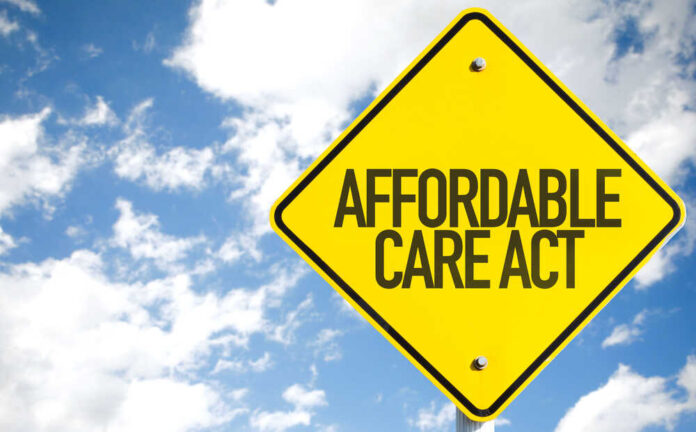 shutterstock_321412865.jpg Yellow traffic sign displaying 'Affordable Care Act' against a blue sky