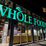 Exterior view of a Whole Foods Market store at night