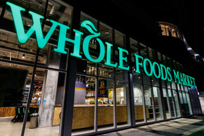 Exterior view of a Whole Foods Market store at night