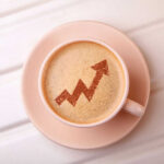 Coffee cup with upward trending arrow design