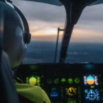 Pilot's view from a helicopter cockpit during sunset