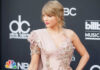 Taylor Swift SUED After Ignoring Warning Taylor Swift in ornate dress.