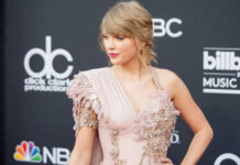 Taylor Swift SUED After Ignoring Warning Taylor Swift in ornate dress.