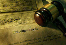 Gavel and Constitution with 1st Amendment text.