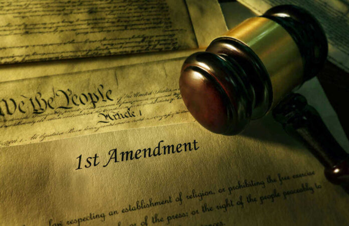 Gavel and Constitution with 1st Amendment text.
