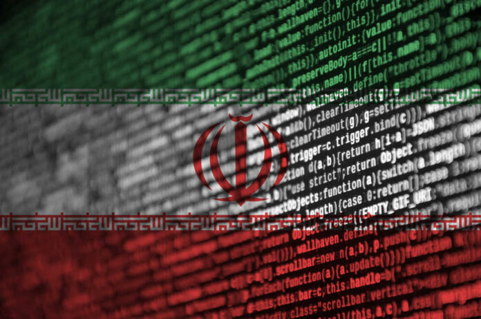 shutterstock_1198192819.jpg Abstract representation of the Iranian flag overlaid with programming code