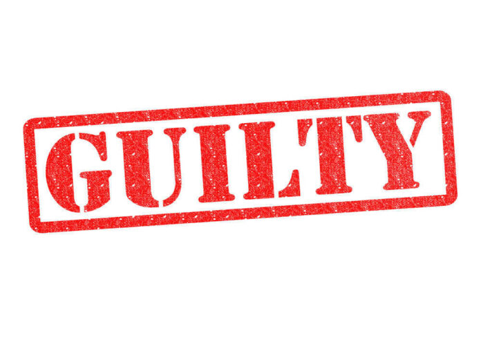 Red stamp with the word guilty inside