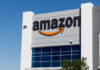 Exterior view of an Amazon building with a prominent logo