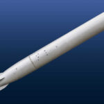 A missile displayed against a blue background