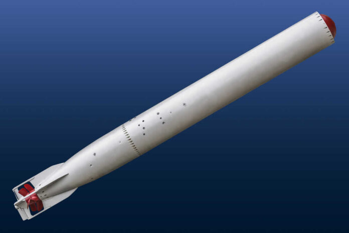 A missile displayed against a blue background