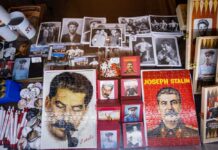 Counterculture Icon DIES — Named After STALIN! A display of various Joseph Stalin memorabilia including photographs, puzzles, and souvenirs