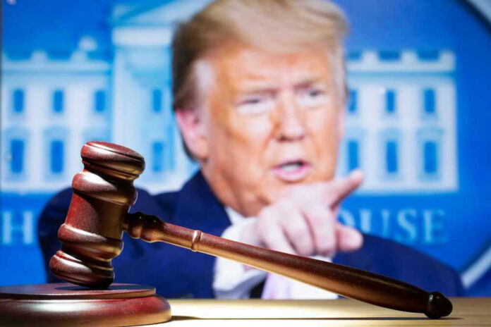 shutterstock_2283594093.jpg Gavel with Donald Trump speaking in the background.
