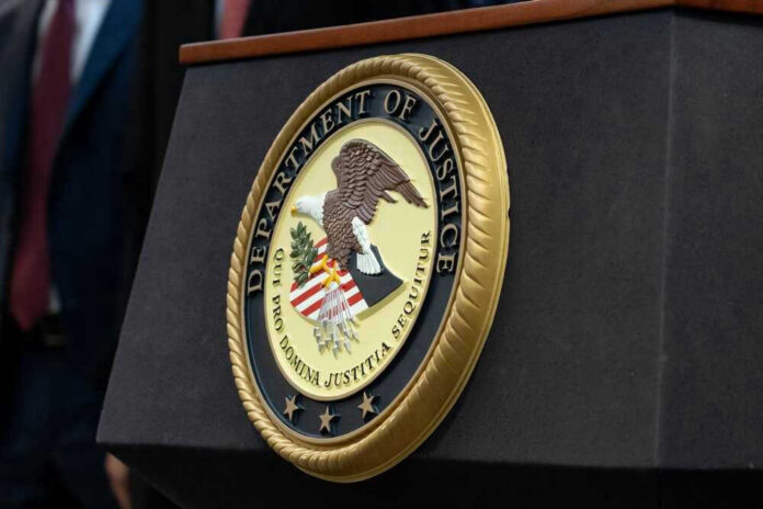 shutterstock_2290672573.jpg Department of Justice seal on a podium.