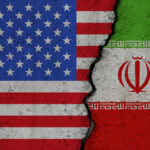 United States and Iran flags divided by crack