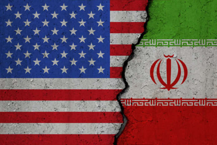 United States and Iran flags divided by crack
