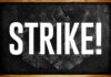 Chalkboard with the word 'STRIKE' written in bold white letters