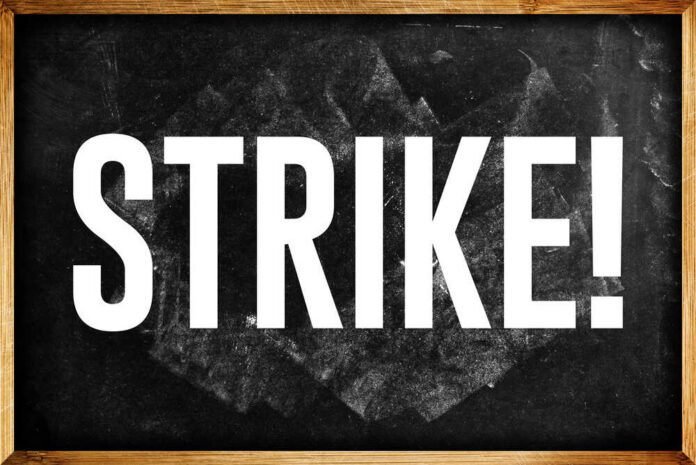 shutterstock_246168655.jpg Chalkboard with the word 'STRIKE' written in bold white letters